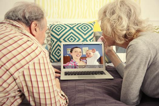 Grandparents having a video call with their family